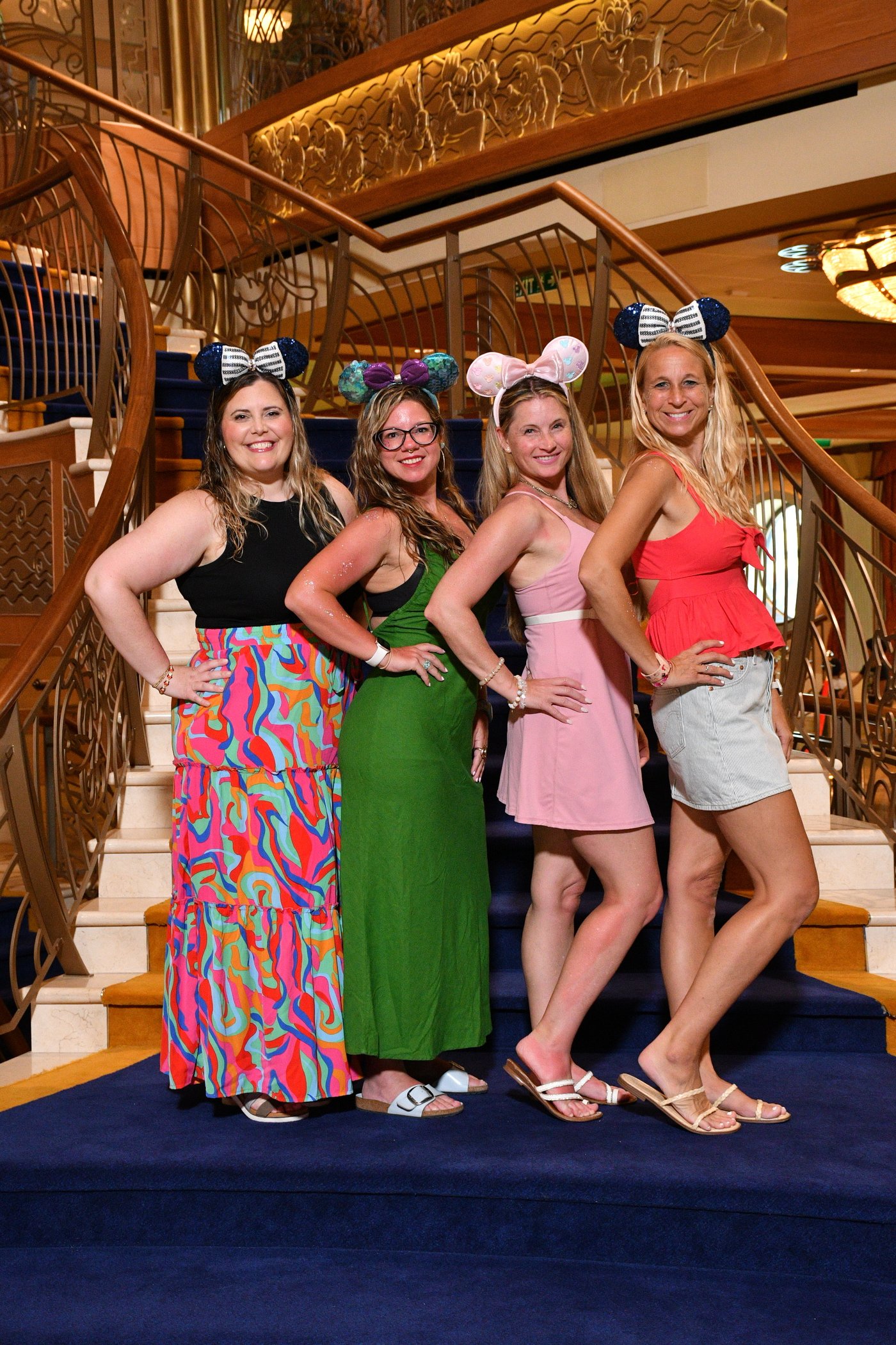 Disney Cruise grand staircase glowing in golden light